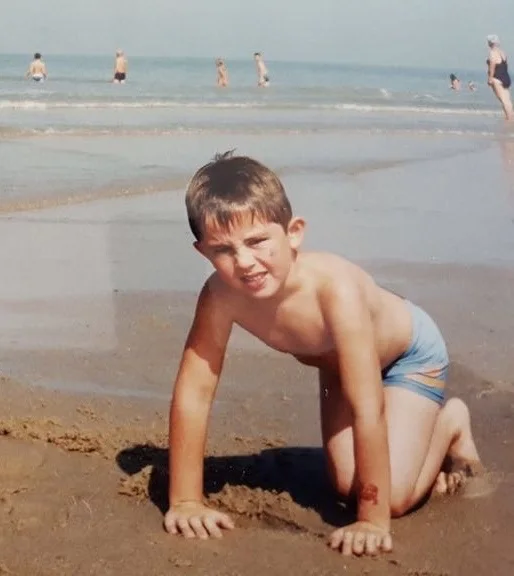 Daniel as a small child on the beach
